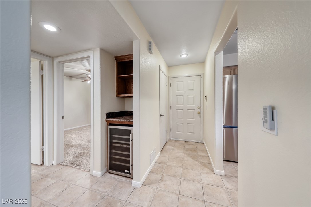 1851 Hillpointe Road, Unit 1811 Henderson, NV 89074 - Photo 2 of 49 Foyer with title flooring and recessed lighting