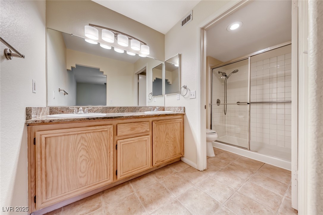 1851 Hillpointe Road, Unit 1811 Henderson, NV 89074 - Photo 23 of 49 Primary bath with double sinks and step-in shower4
