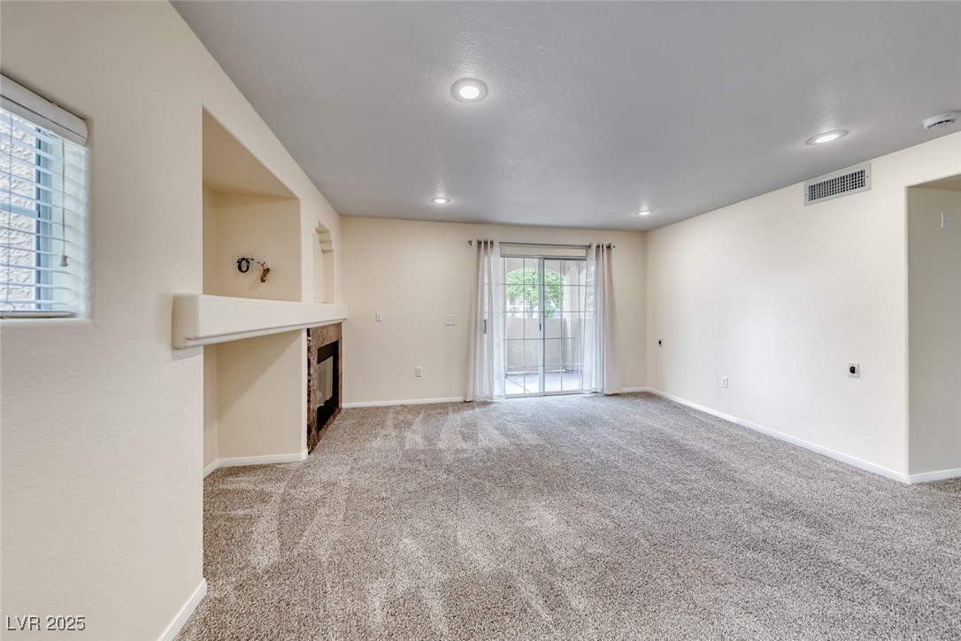 1851 Hillpointe Road, Unit 1811 Henderson, NV 89074 - Photo 6 of 49 Living room with sliding glass doors to patio