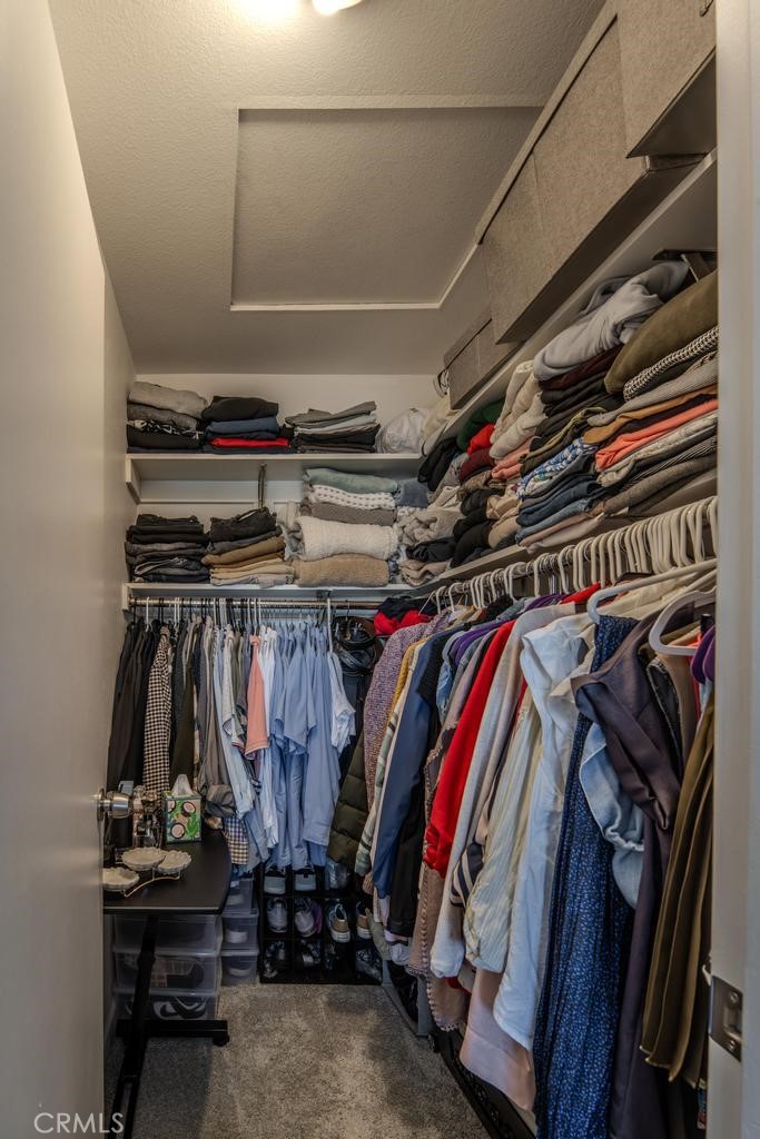 45664 Balmoral Court Lancaster, CA 93534 - Photo 24 of 38 a view of walk in closet with clothes and shoes