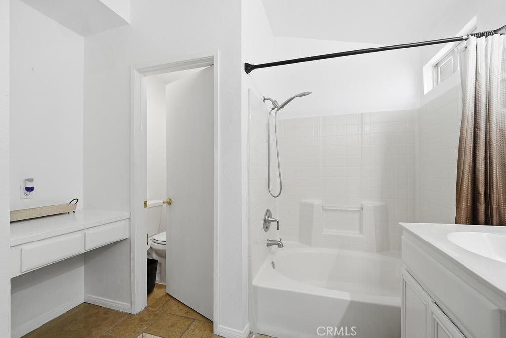 45664 Balmoral Court Lancaster, CA 93534 - Photo 28 of 38 a bathroom with a bathtub and a shower