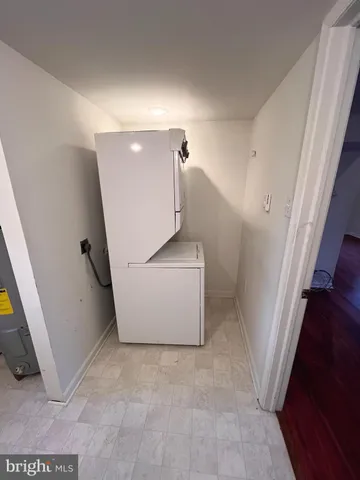 a view of a yard with wooden fence