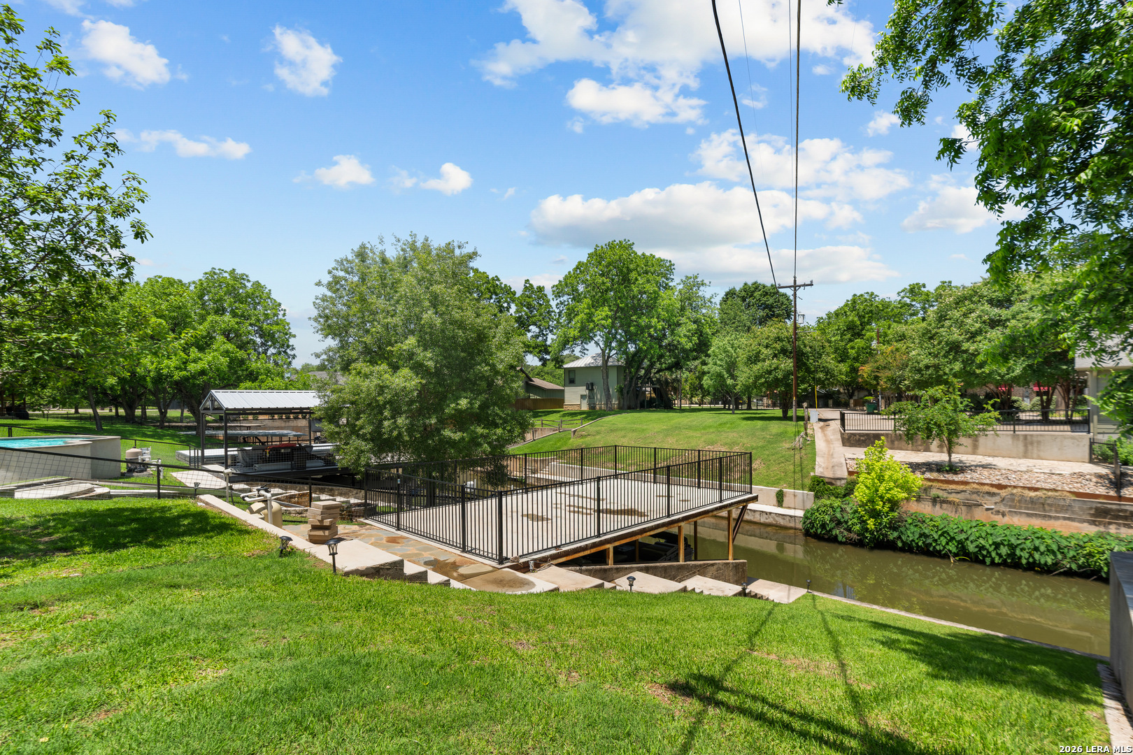 3900 Apache Circle Kingsland, TX 78639 - Photo 11 of 36 a view of a swimming pool with a garden and plants