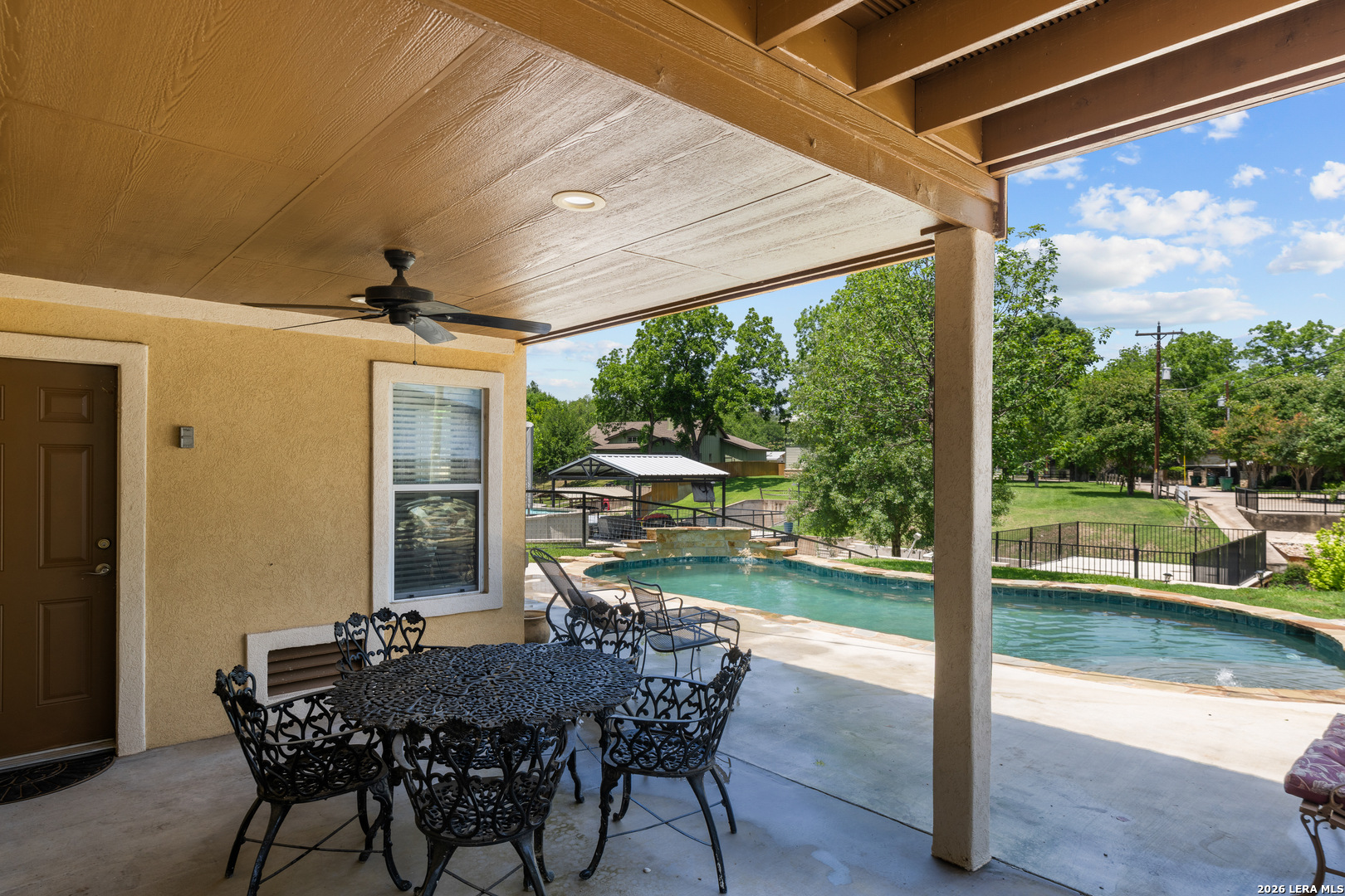 3900 Apache Circle Kingsland, TX 78639 - Photo 12 of 36 a view of a patio with a table chairs and a backyard