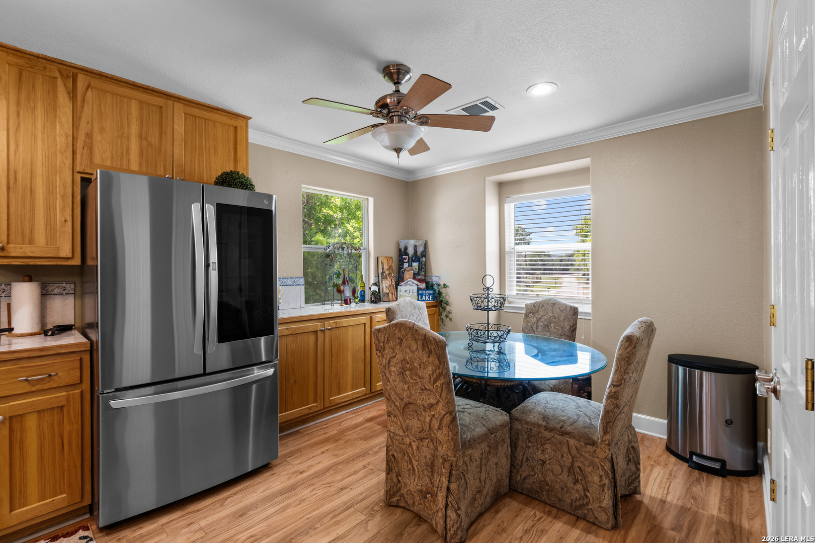 3900 Apache Circle Kingsland, TX 78639 - Photo 17 of 36 a dining room with furniture a window and wooden floor