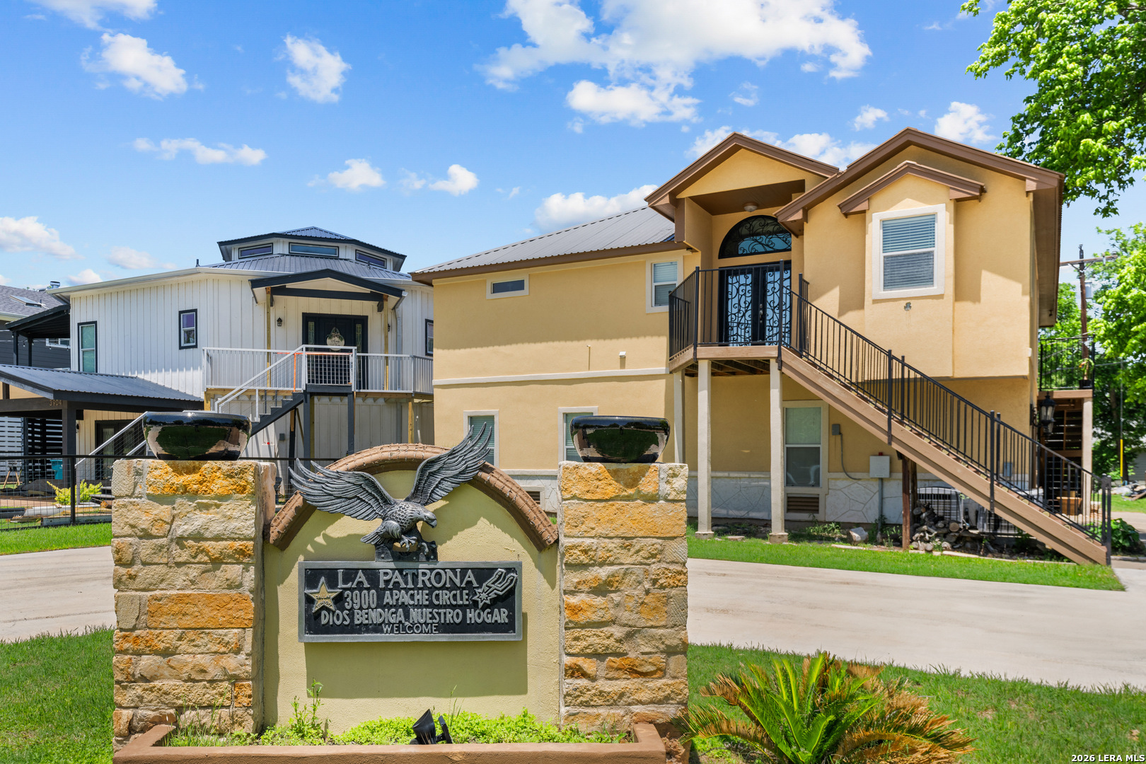 3900 Apache Circle Kingsland, TX 78639 - Photo 2 of 36 a front view of a house with garden