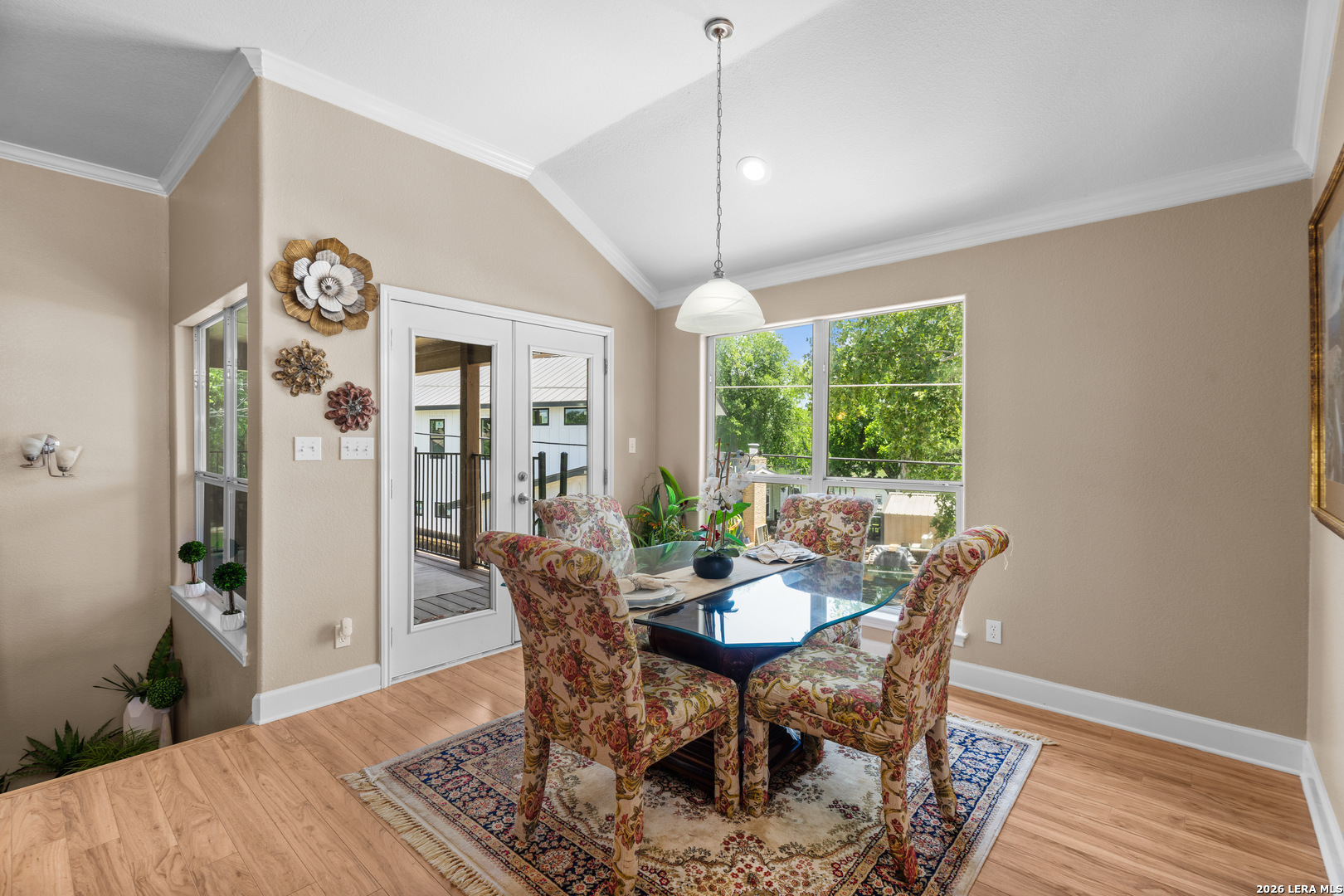 3900 Apache Circle Kingsland, TX 78639 - Photo 21 of 36 a dining room with furniture a rug and wooden floor