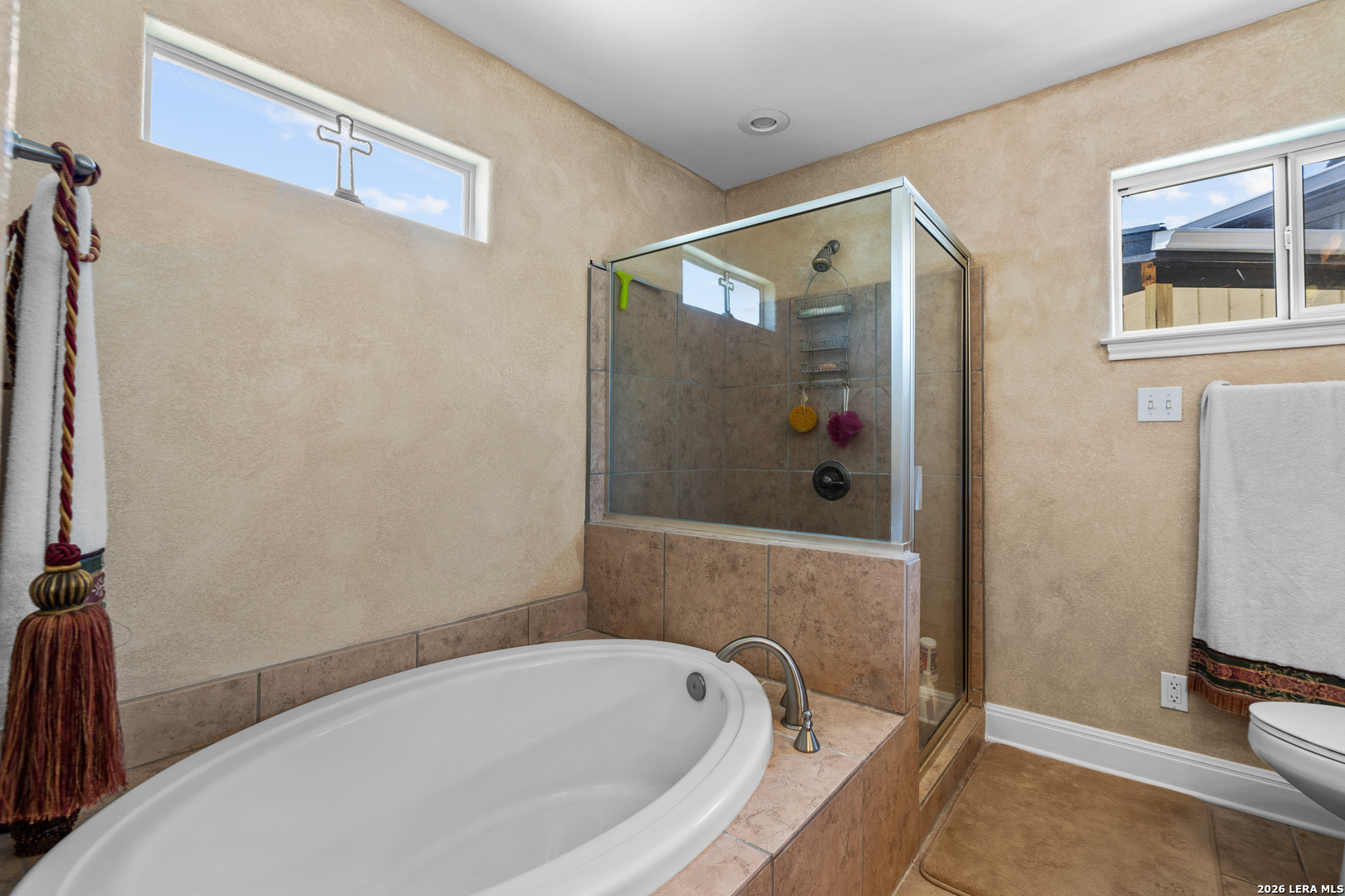 3900 Apache Circle Kingsland, TX 78639 - Photo 28 of 36 a bathroom with a tub and shower