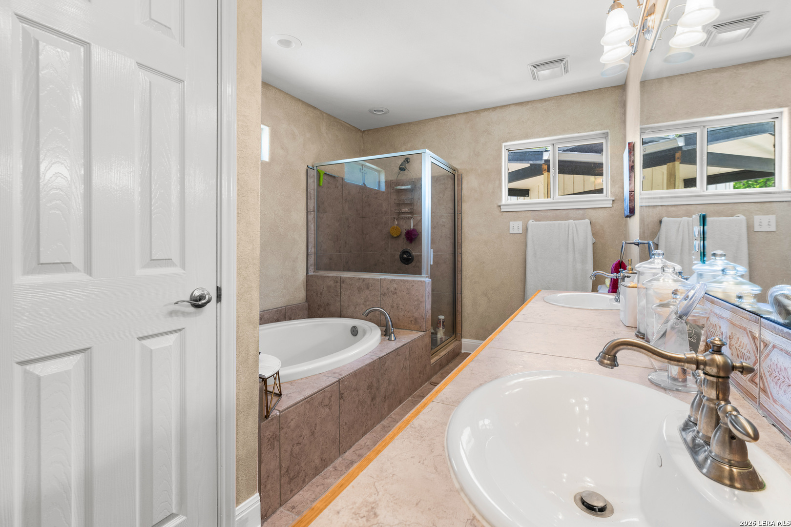 3900 Apache Circle Kingsland, TX 78639 - Photo 29 of 36 a bathroom with a tub sink and mirror
