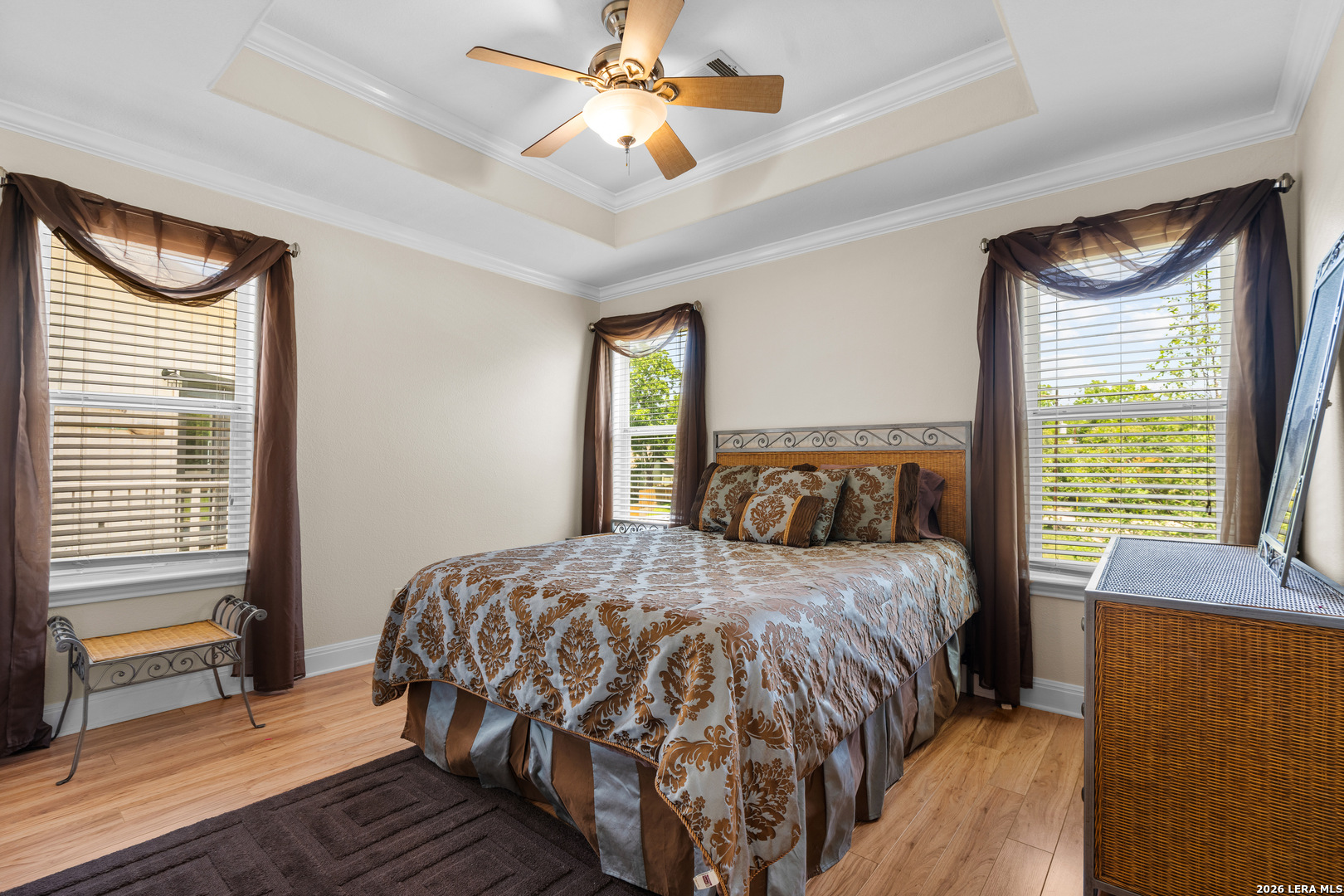 3900 Apache Circle Kingsland, TX 78639 - Photo 30 of 36 a bedroom with a bed and a chandelier