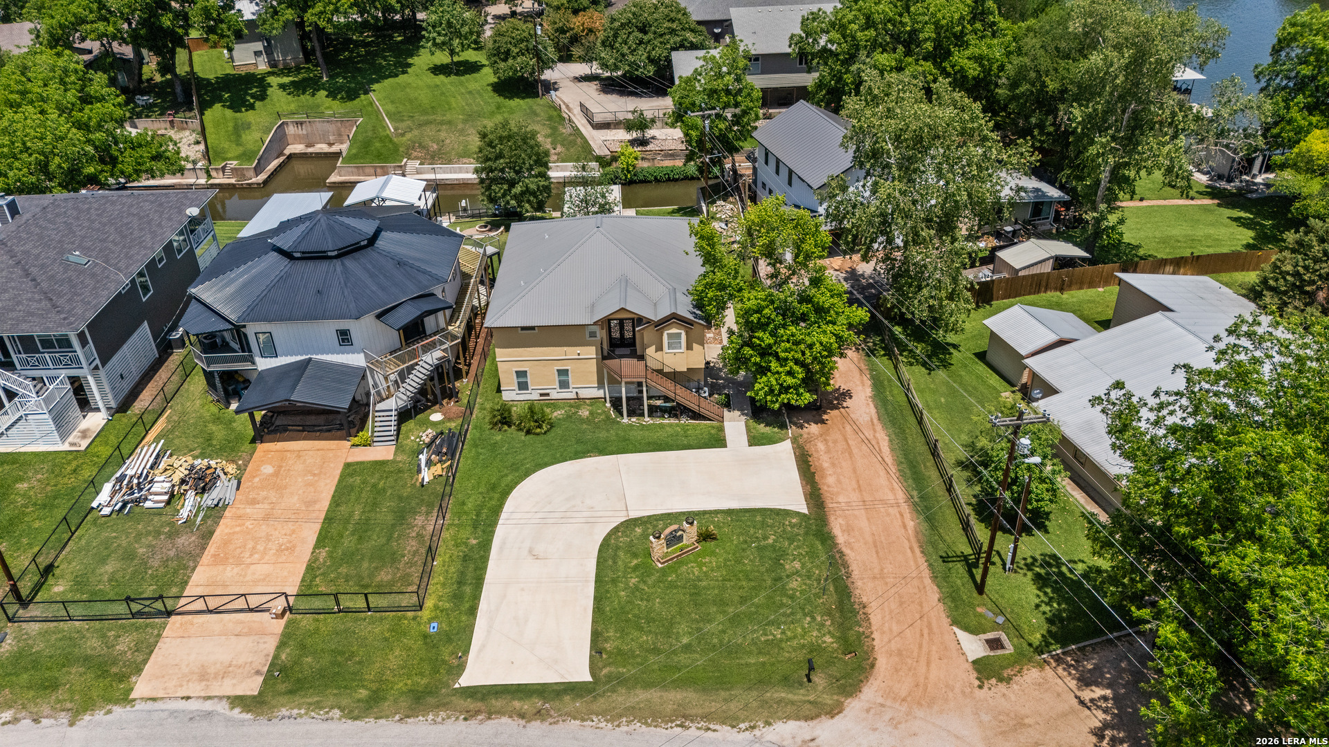 3900 Apache Circle Kingsland, TX 78639 - Photo 3 of 36 an aerial view of a house with garden space and street view