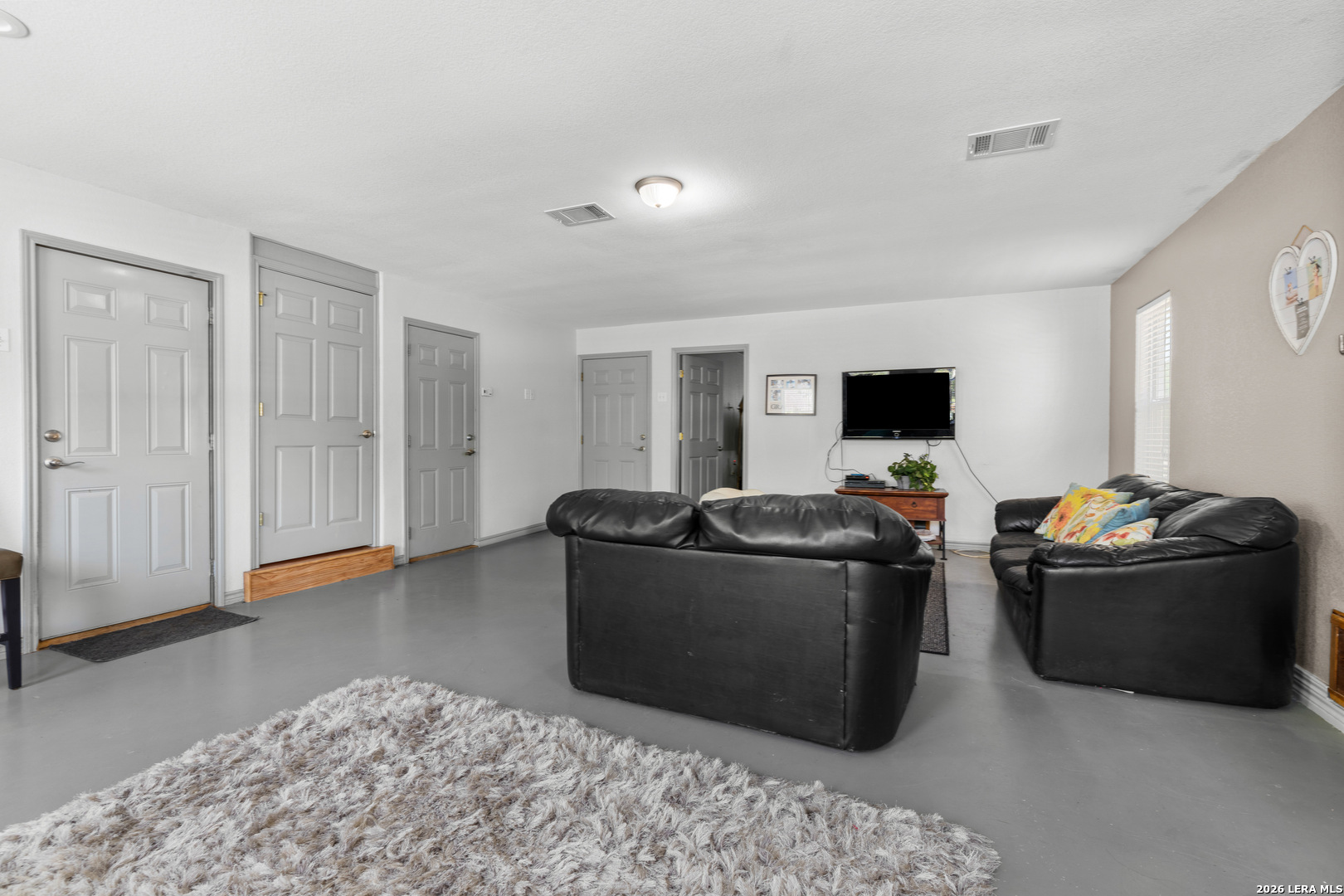 3900 Apache Circle Kingsland, TX 78639 - Photo 36 of 36 a living room with furniture and a flat screen tv