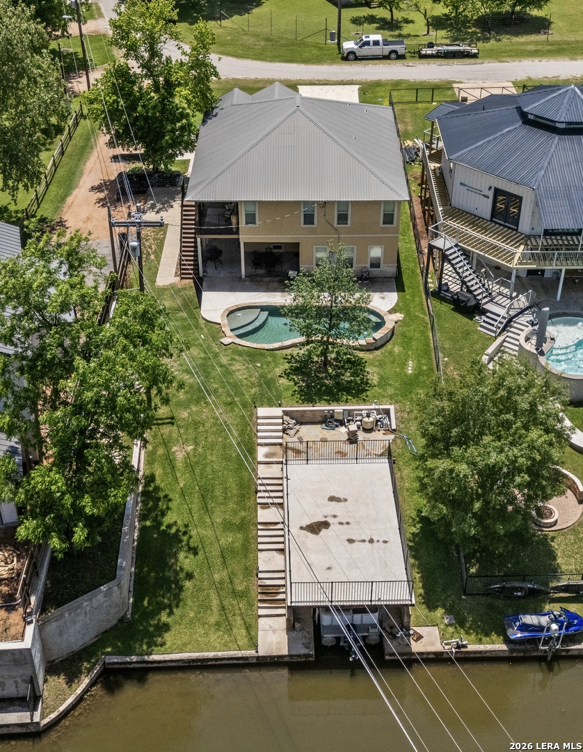 3900 Apache Circle Kingsland, TX 78639 - Photo 4 of 36 an aerial view of a house with a garden and lake view