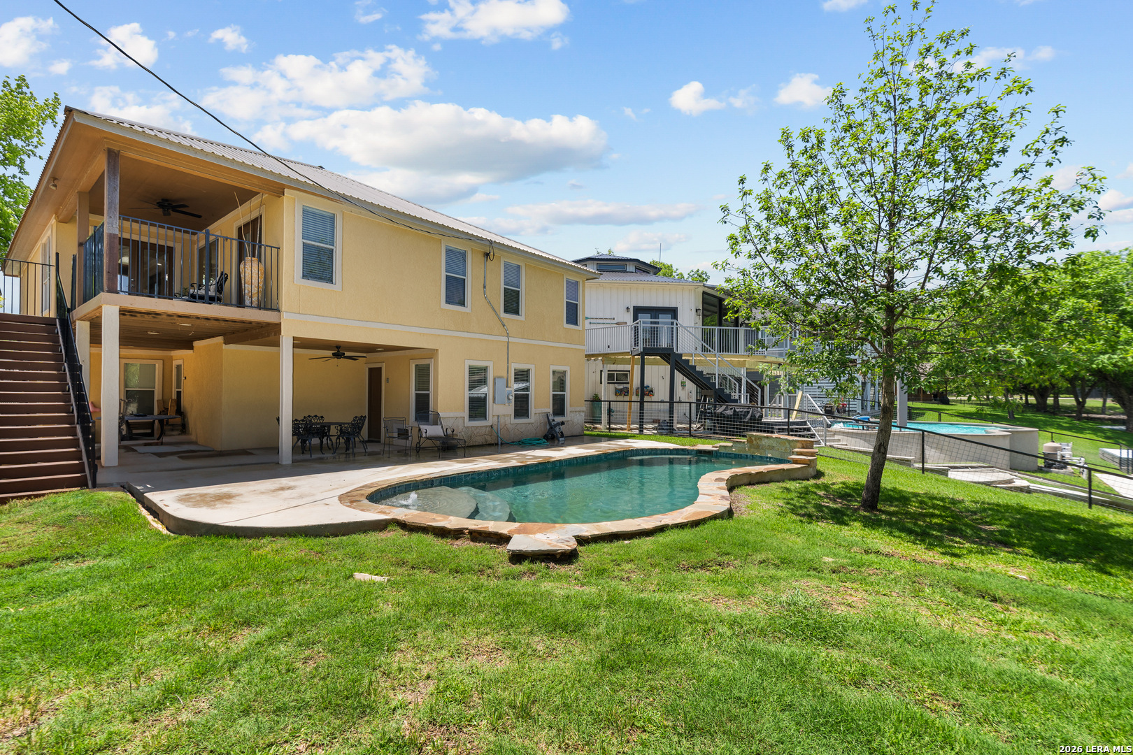 3900 Apache Circle Kingsland, TX 78639 - Photo 8 of 36 a view of a house with a yard patio and swimming pool