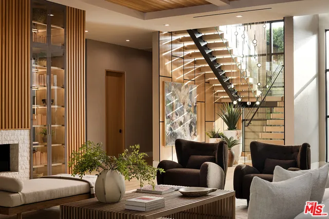 a view of a livingroom with furniture and a fireplace