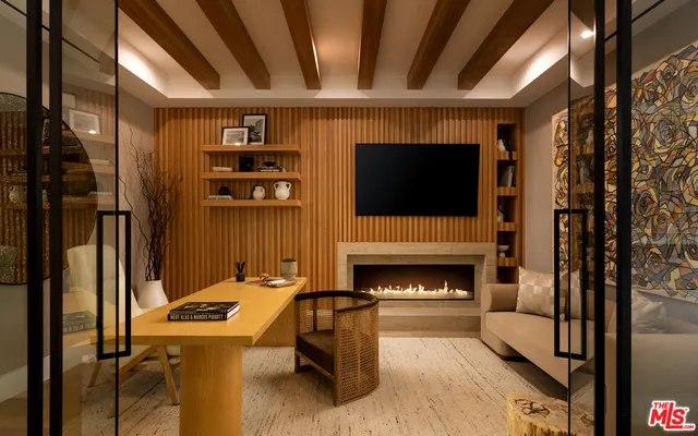 a living room with furniture a flat screen tv and a floor to ceiling window