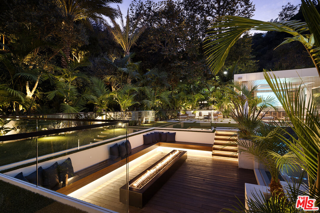 13187 Chalon Road Los Angeles, CA 90049 - Photo 37 of 39 a view of swimming pool with outdoor seating and plants