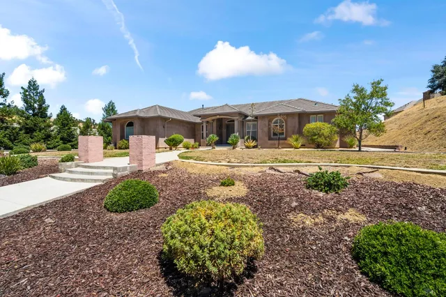 a view of a hallway with wooden shelves