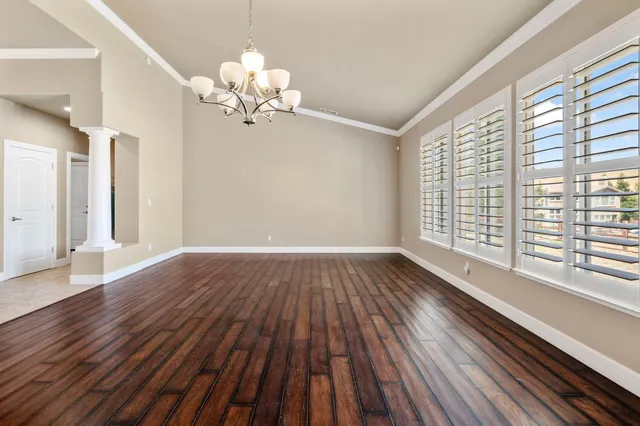 a bedroom with a bed and a ceiling fan