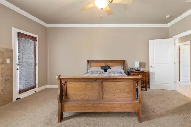 a kitchen with kitchen island a counter top space a sink stainless steel appliances and cabinets