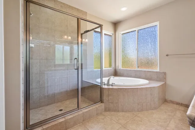 a kitchen with stainless steel appliances granite countertop a refrigerator and a stove