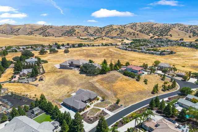 an aerial view of residential building and ocean