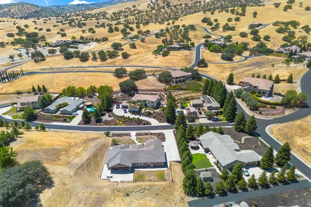 an aerial view of a house with a ocean view