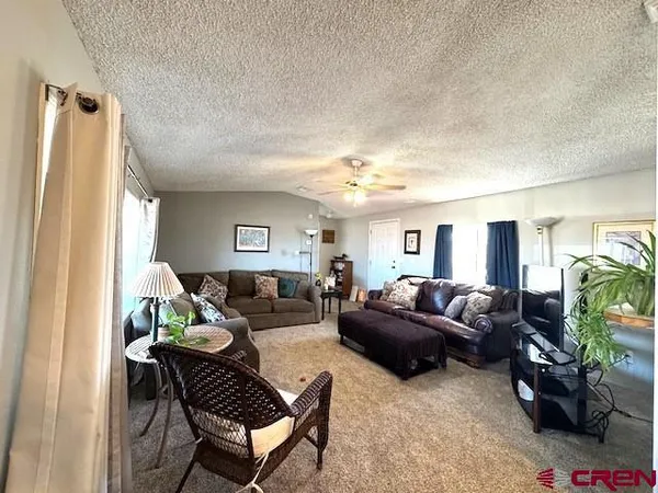 a spacious bedroom with a bed and window