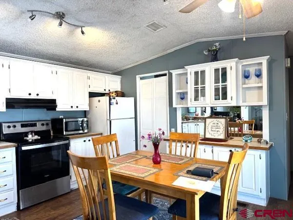 a bedroom with a bed and ceiling fan