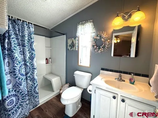 a white toilet sitting next to a bathroom sink