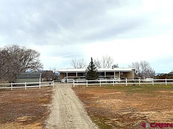 a view of a swimming pool with an outdoor seating