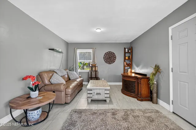 a living room with furniture and a window