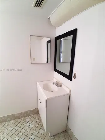 a bathroom with a toilet a sink and a window