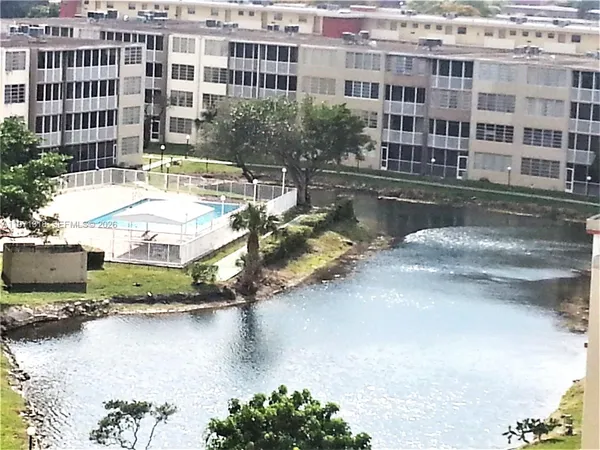 a view of swimming pool with a outdoor seating