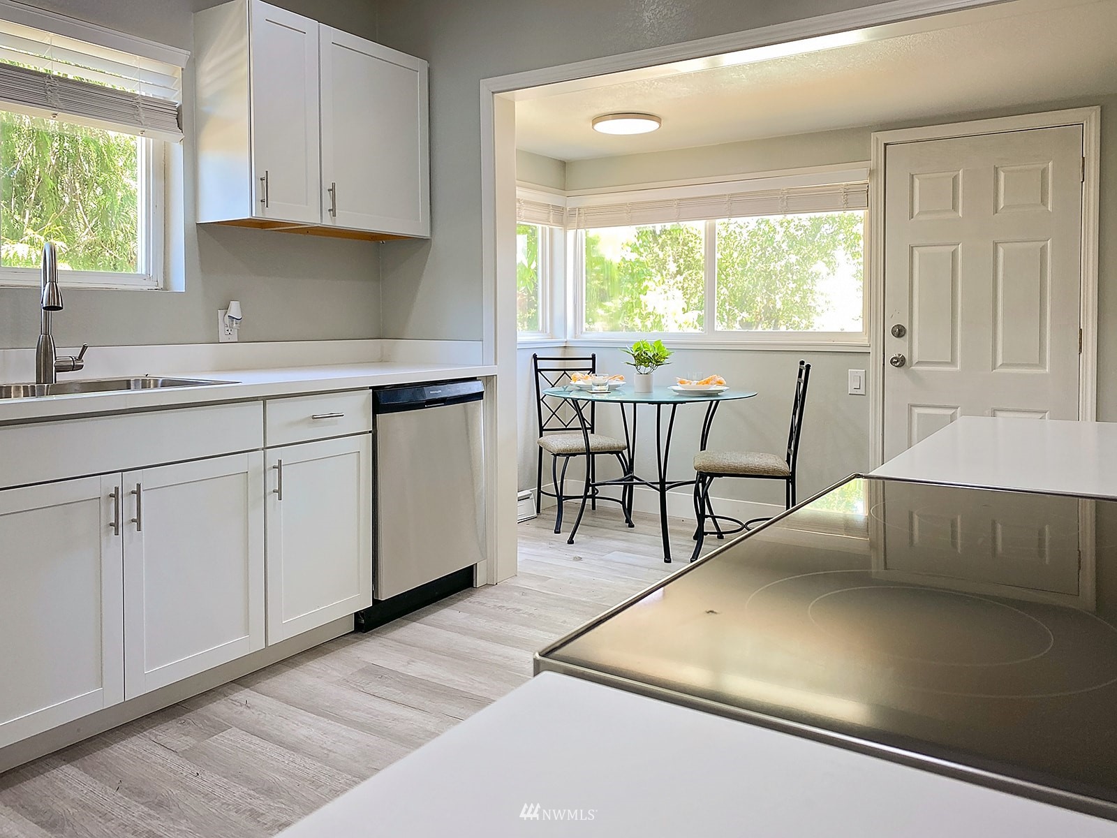 1005 9th Street Southwest Puyallup, WA 98371 - Photo 13 of 40 a kitchen with white cabinets and sink