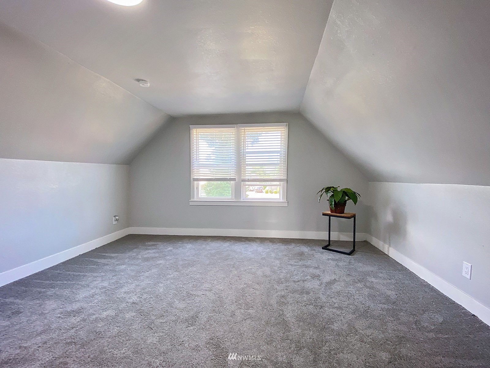 1005 9th Street Southwest Puyallup, WA 98371 - Photo 27 of 40 an empty room with windows and natural light