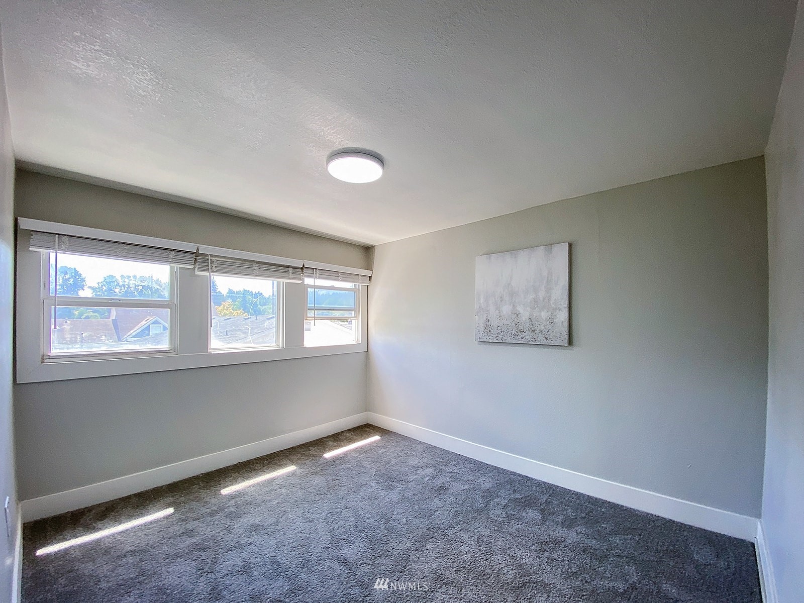 1005 9th Street Southwest Puyallup, WA 98371 - Photo 29 of 40 an empty room with a window