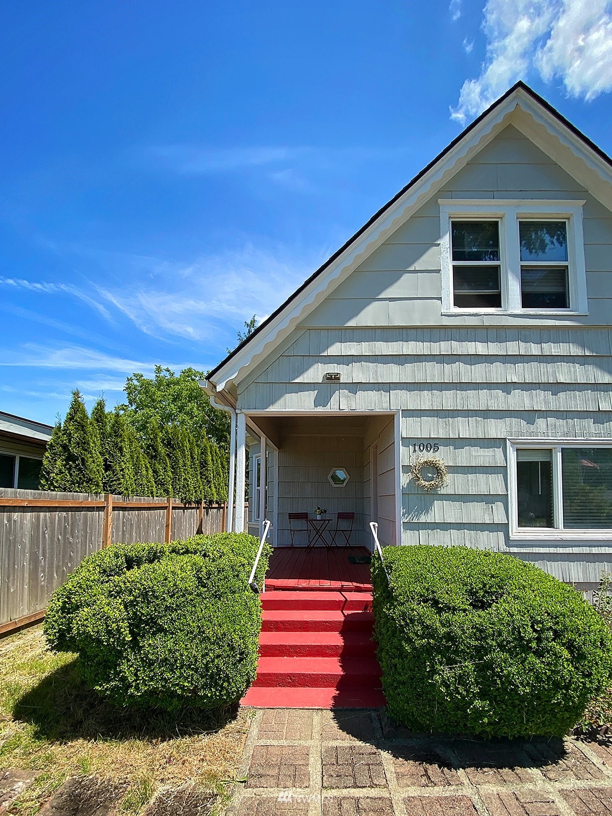 1005 9th Street Southwest Puyallup, WA 98371 - Photo 3 of 40 a front view of a house with a yard