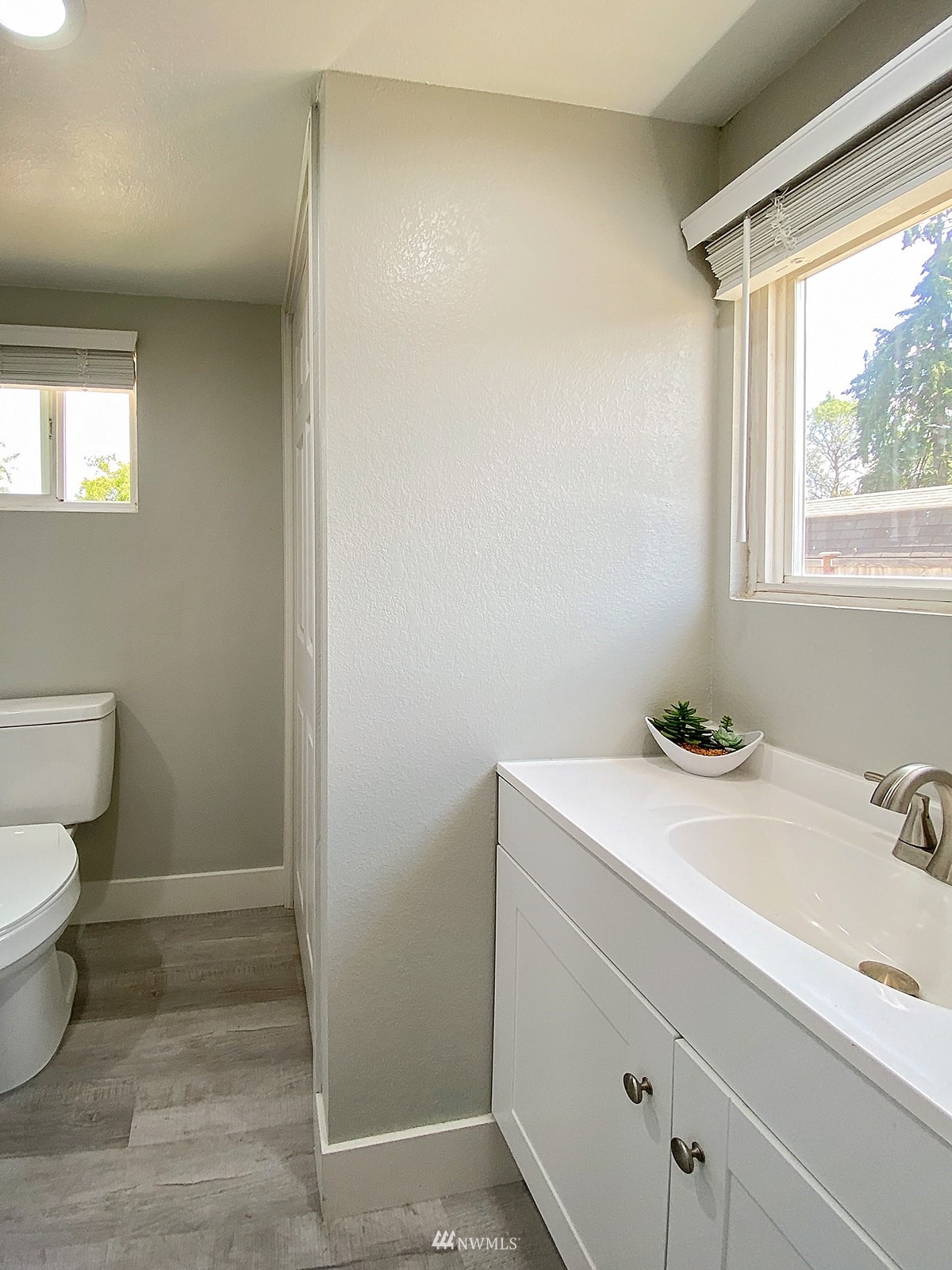 1005 9th Street Southwest Puyallup, WA 98371 - Photo 32 of 40 a bathroom with a sink and a toilet