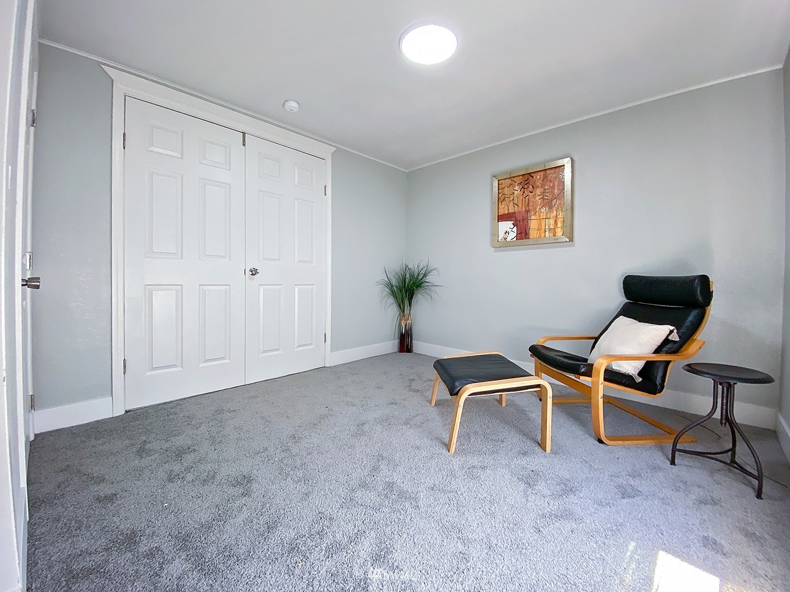 1005 9th Street Southwest Puyallup, WA 98371 - Photo 35 of 40 a view of a workspace with furniture and a chair