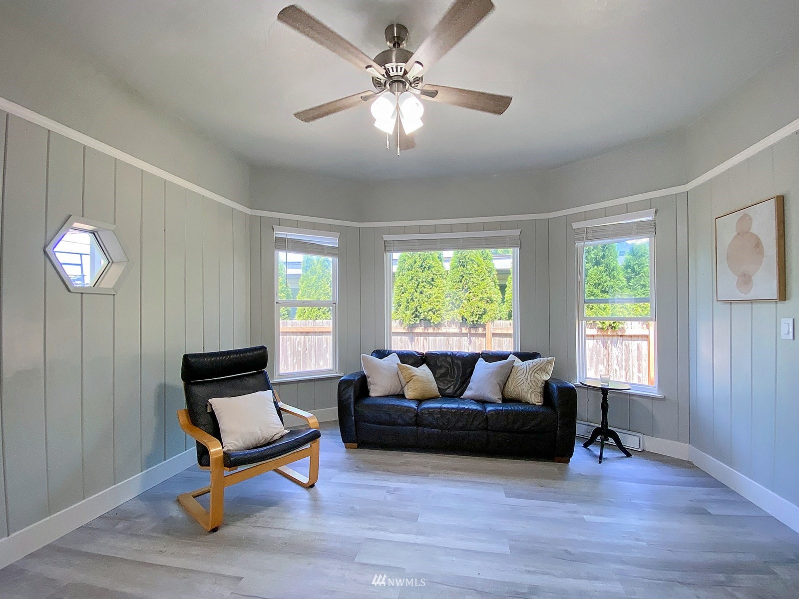 1005 9th Street Southwest Puyallup, WA 98371 - Photo 36 of 40 a living room with furniture a window and a chandelier