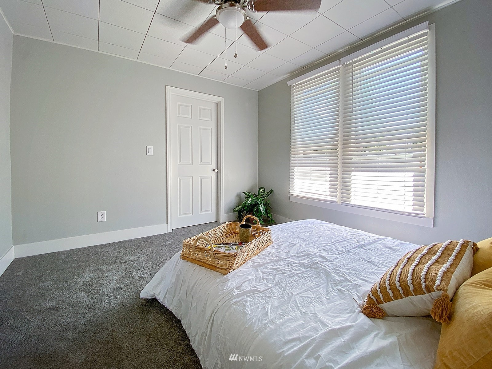 1005 9th Street Southwest Puyallup, WA 98371 - Photo 38 of 40 a bed sitting in a bedroom next to a window