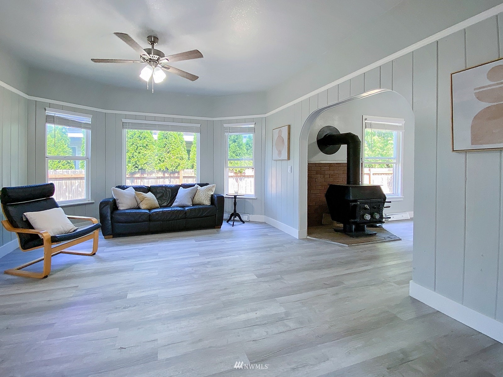 1005 9th Street Southwest Puyallup, WA 98371 - Photo 8 of 40 a living room with furniture and a chandelier