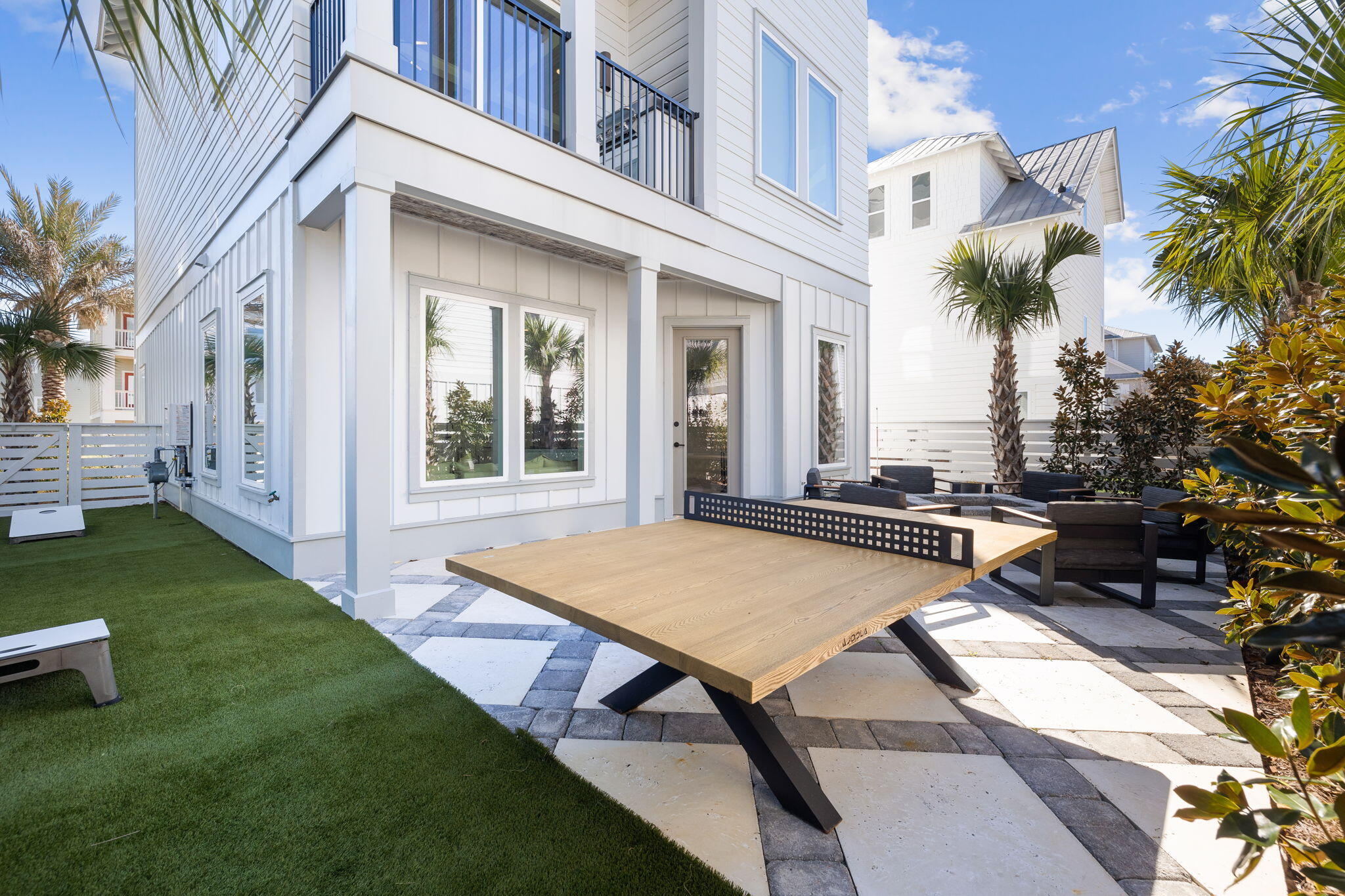 18 Inlet Heights Lane Inlet Beach, FL 32461 - Photo 13 of 46 a view of a patio with table and chairs and potted plants