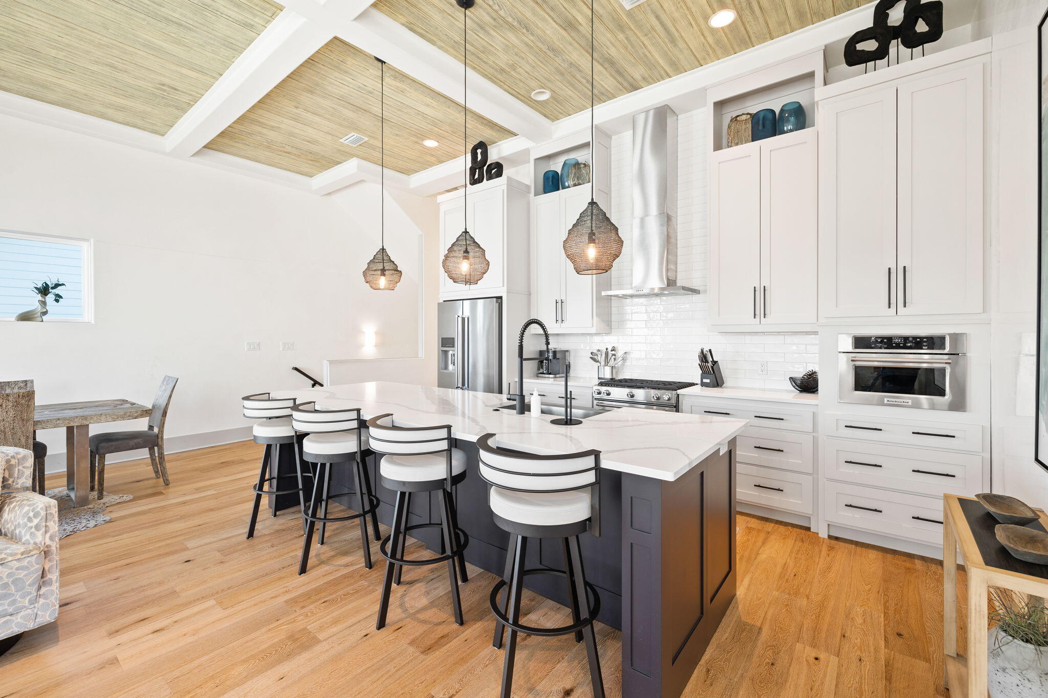 18 Inlet Heights Lane Inlet Beach, FL 32461 - Photo 20 of 46 a kitchen with a table chairs stove and cabinets
