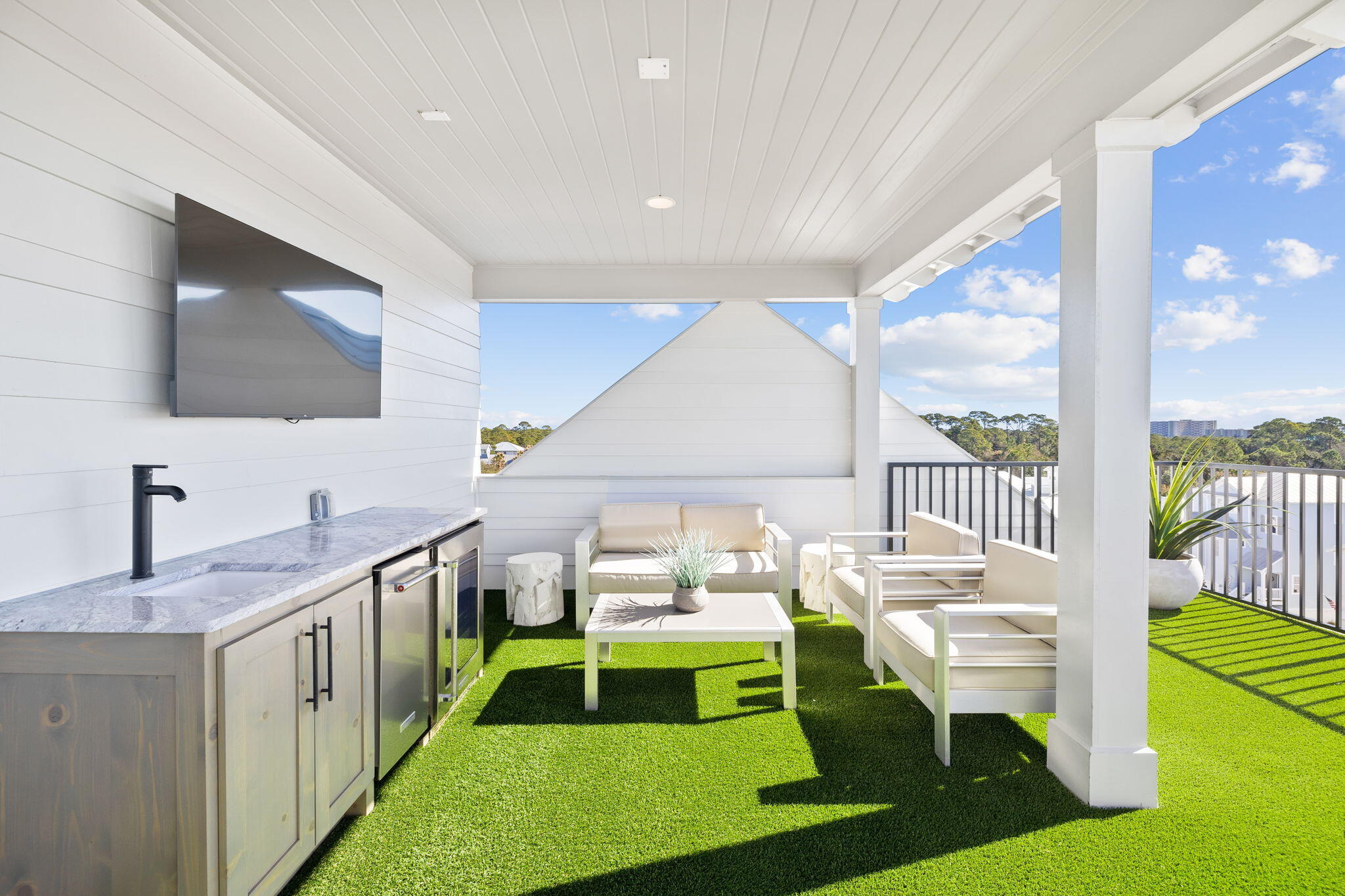 18 Inlet Heights Lane Inlet Beach, FL 32461 - Photo 4 of 46 a kitchen with a table chairs and a flat screen tv