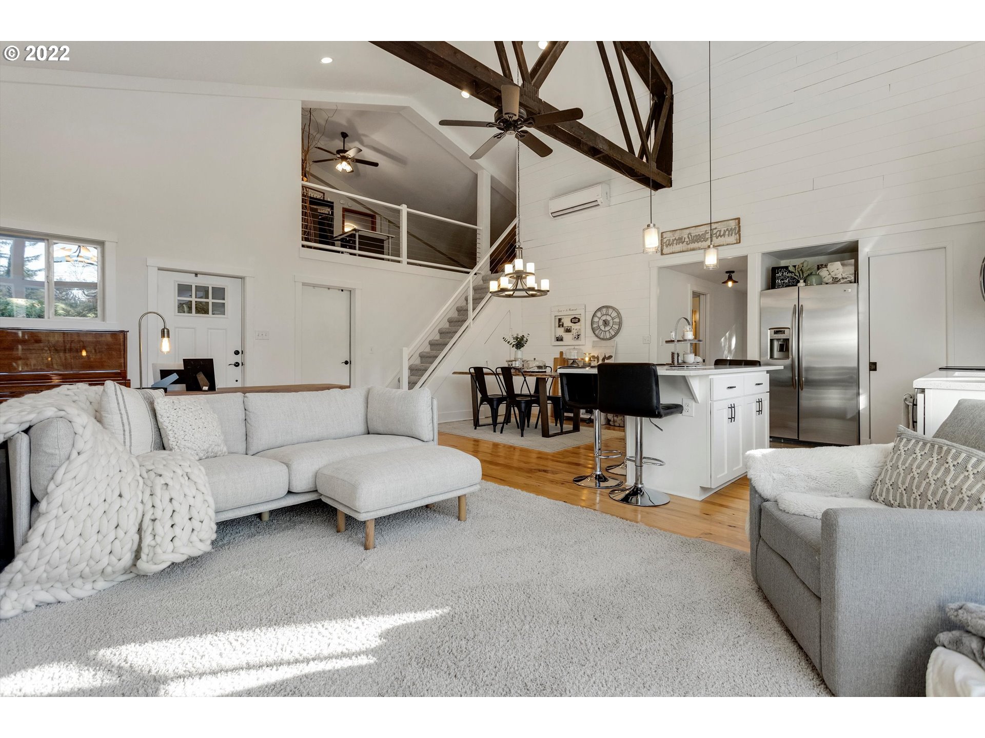 22543 South Central Point Road Oregon City, OR 97045 - Photo 7 of 32 a living room with furniture and kitchen view