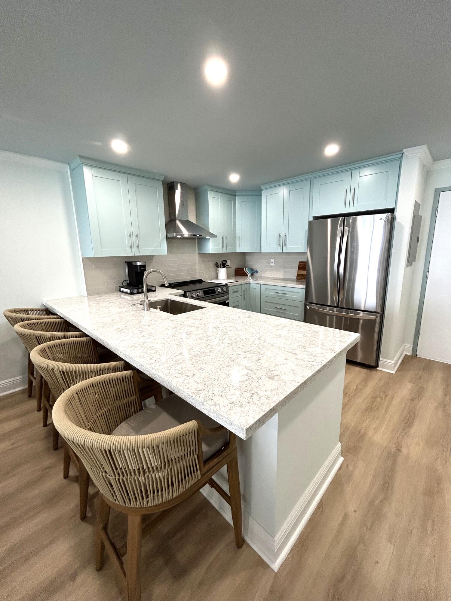 400 North Surf Road, Unit 1105 Hollywood, FL 33019 - Photo 1 of 15 a kitchen with kitchen island a appliances a sink and a center island