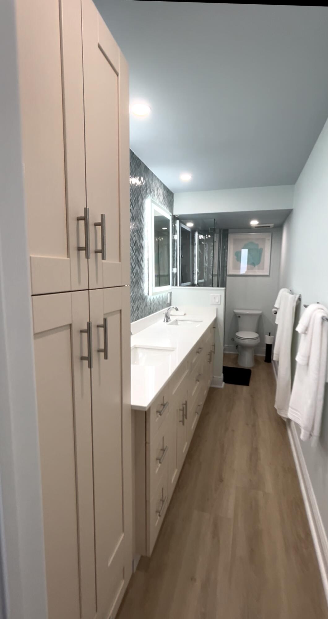 400 North Surf Road, Unit 1105 Hollywood, FL 33019 - Photo 8 of 15 a bathroom with a double vanity sink and mirror