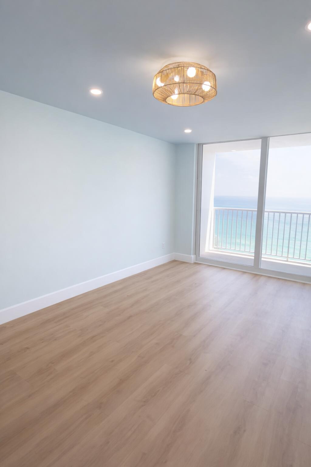 400 North Surf Road, Unit 1105 Hollywood, FL 33019 - Photo 10 of 15 an empty room with wooden floor and windows